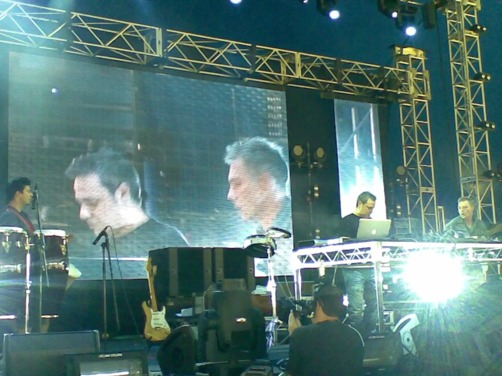 Waks Traks performing beneath a large festival screen