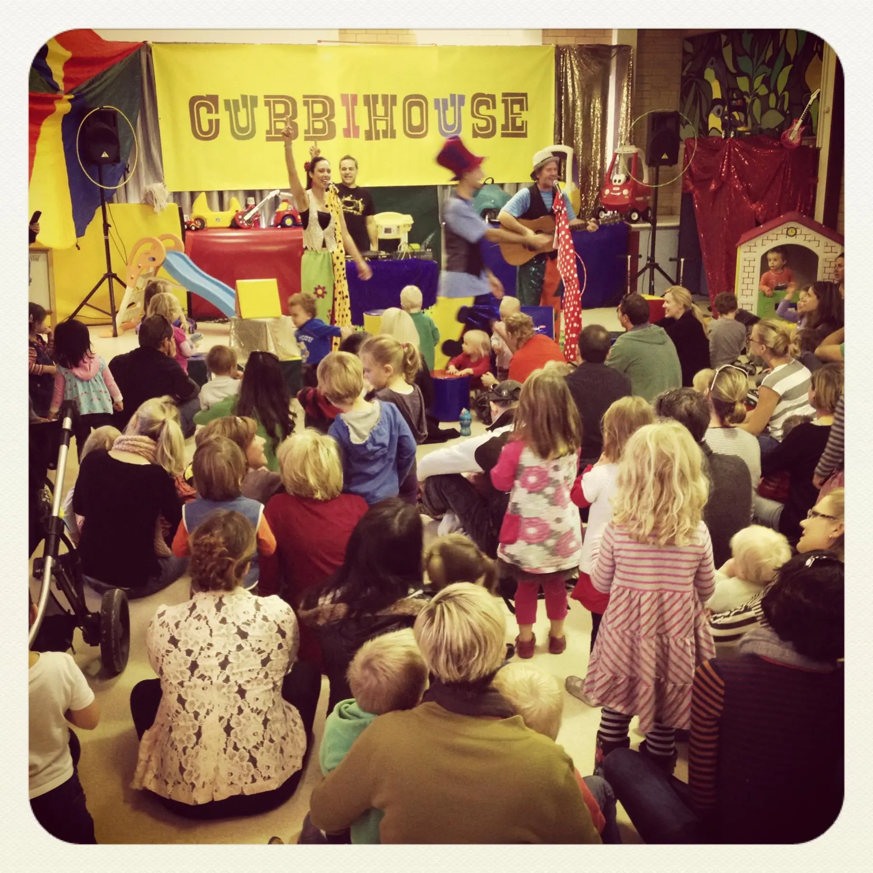 Children and families gathered for a Cubbyhouse performance