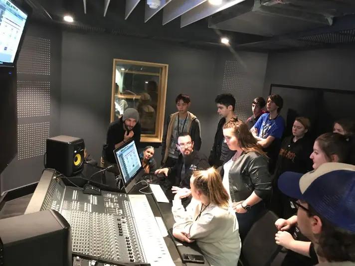 Sam Cutri teaching audio production in a recording studio