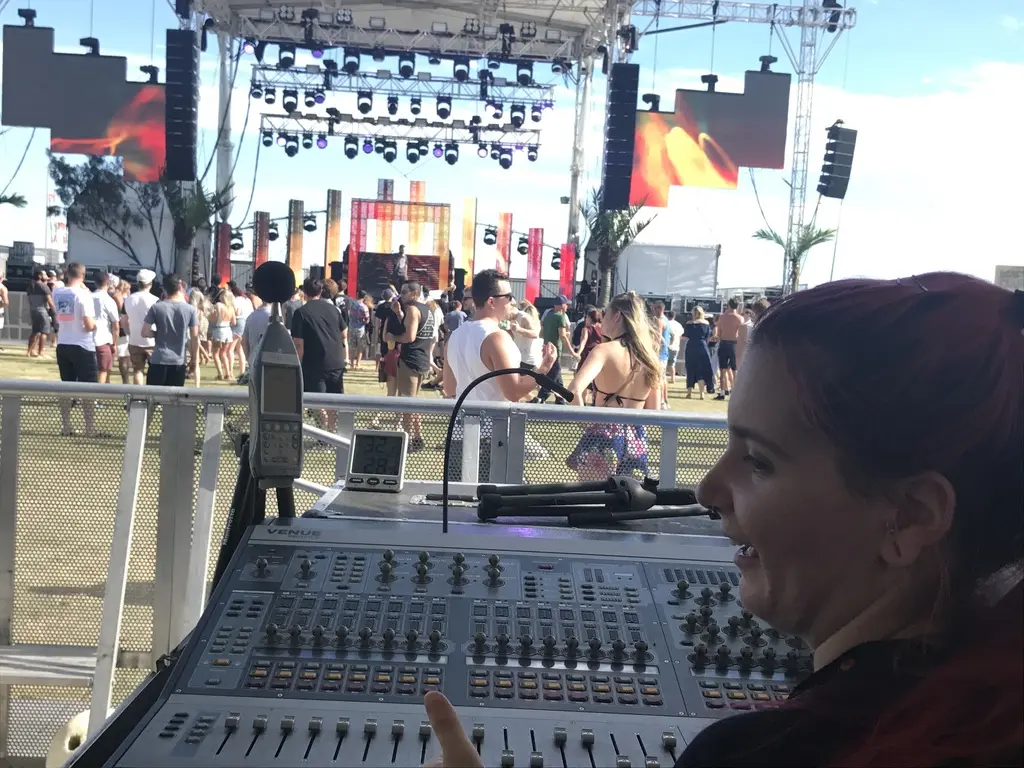 Front-of-house mixing position overlooking a large outdoor concert